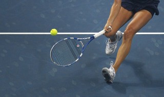 Radwanska of Poland hits a return to Petkovic of Germany during their women's final match at the China Open tennis tournament in Beijing